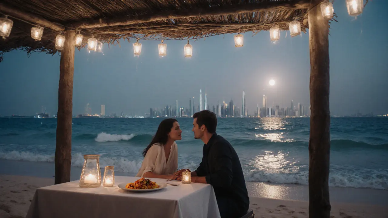 A couple dining on a beachfront cabana under lantern lights as moonlight reflects on the Arabian Gulf.